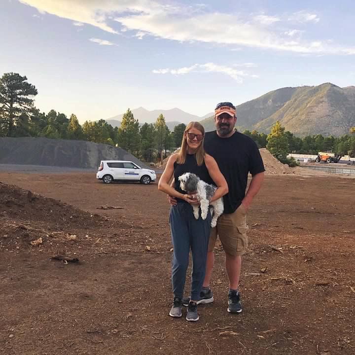 Jenn & David with Their Dog Standing On Future Site of Tiny House Village Development